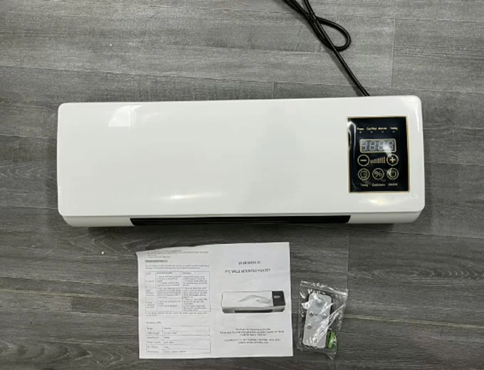 Real-world photo of Heatoor heater with manuals and mounting hardware
